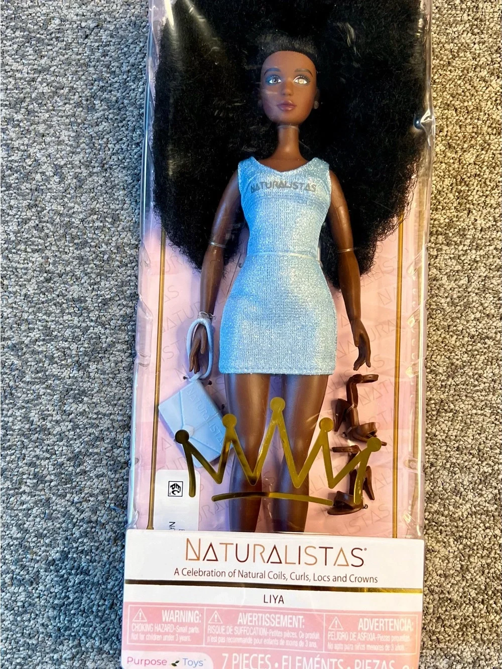 El Naturalista Kids Doll in Light Blue Dress with Dark Brown Skin and Black Hair